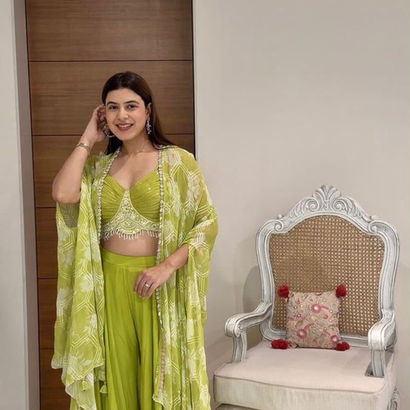 Peach lehenga on a courtyard swing
